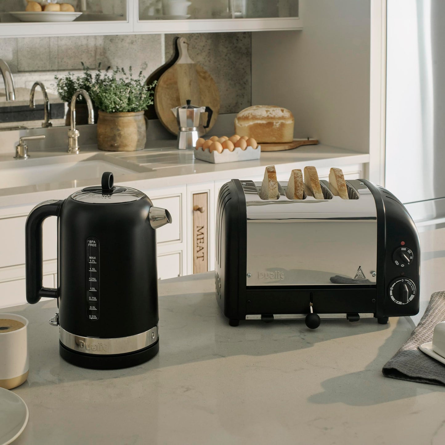 Dualit Classic 4 Slice Toaster: stainless steel build, handcrafted, 4-slice capacity, replaceable elements, ideal for families.