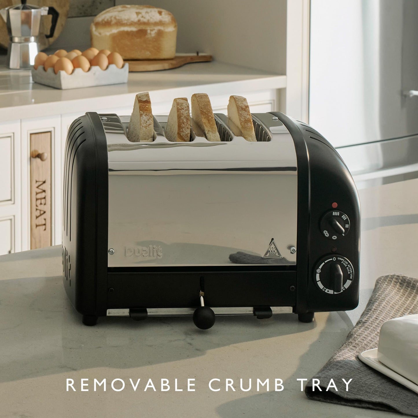 Dualit Classic 4 Slice Toaster: stainless steel build, handcrafted, 4-slice capacity, replaceable elements, ideal for families.